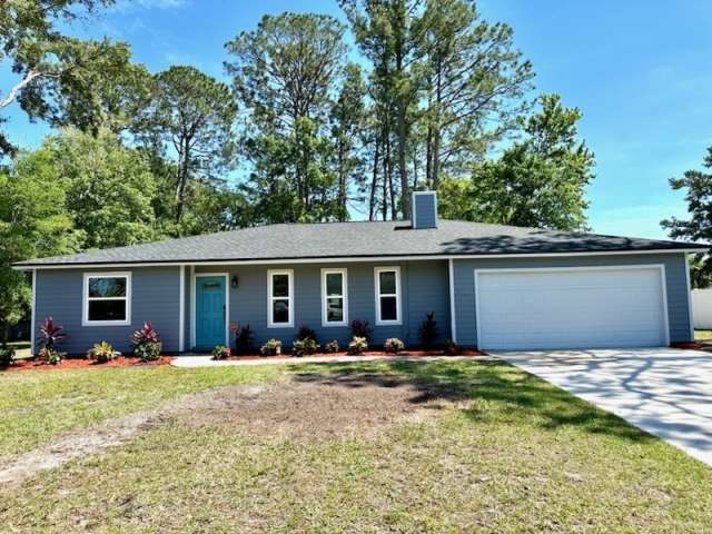 Price Improvement! Newly Renovated 3 BR 2 Bath home on 1/2 acre lot
